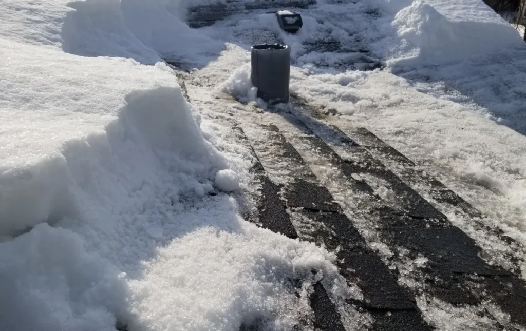snow on asphalt shingles