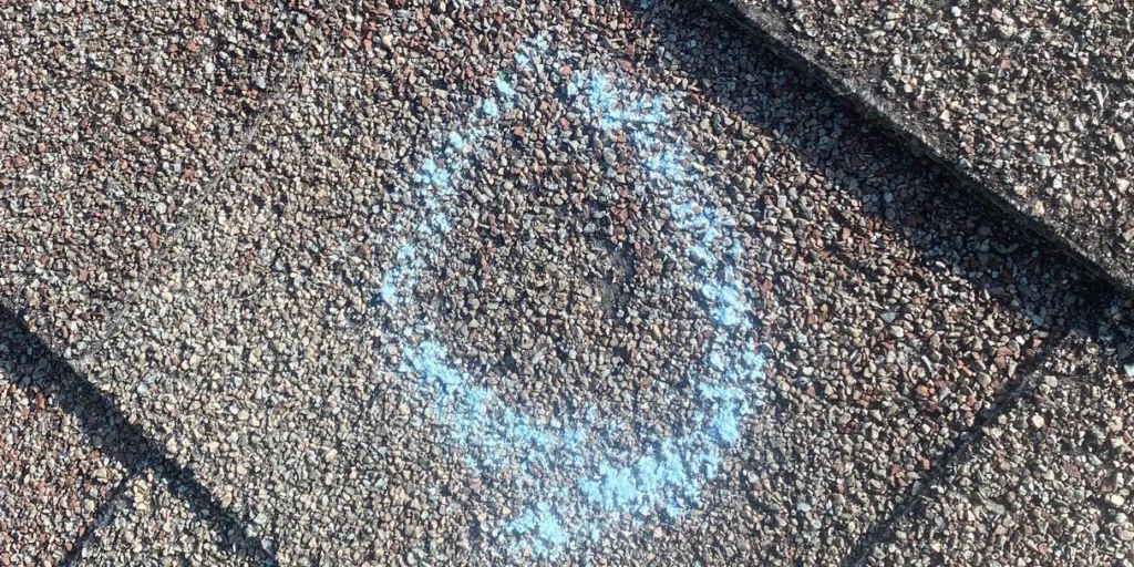 Punctures and dents on asphalt shingles